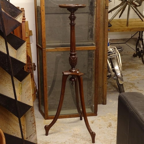 2581 - A reproduction mahogany torcher stand, H115cm