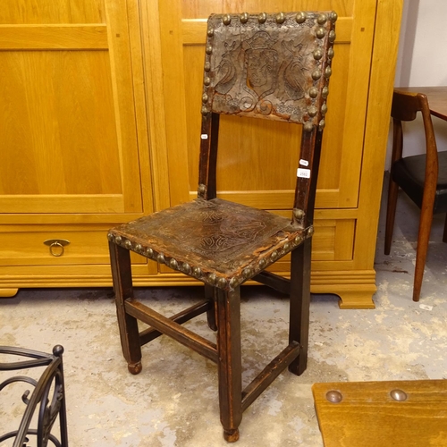 2582 - A 17th/18thC Spanish walnut back stool, with heraldic tooled leather panels