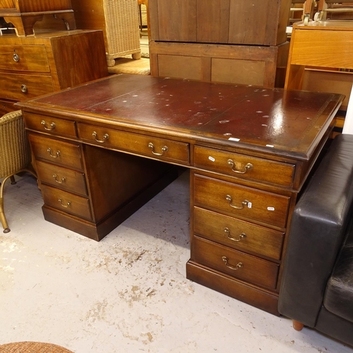 2585 - A mahogany twin-pedestal writing desk with fitted drawers, W153cm, H76cm, D91cm, kneehole width 58cm... 