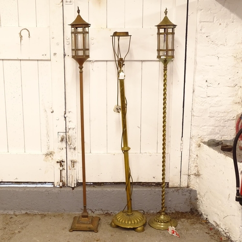 2594 - 2 brass standard lamps, and a copper standard lamp, tallest 154cm (3)