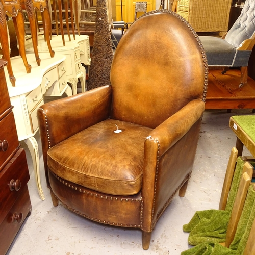 2597 - An early 20th century studded brown leather upholstered armchair, W80cm, H115cm, seat height 46cm an... 