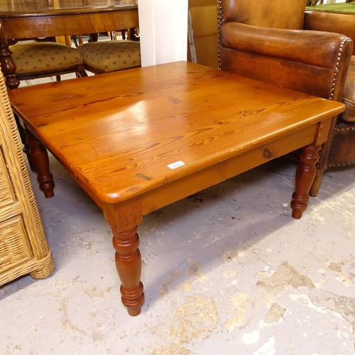 2599 - A Oregon pine square coffee table, on turned legs, W90cm, H48cm