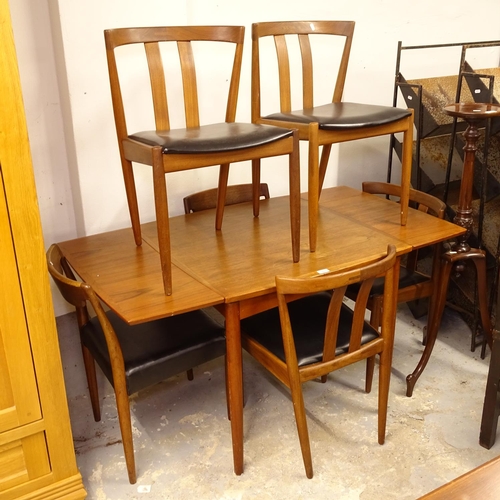 2609 - A mid-century Danish teak draw leaf dining table, together with a set of 6 matching chairs, table le... 