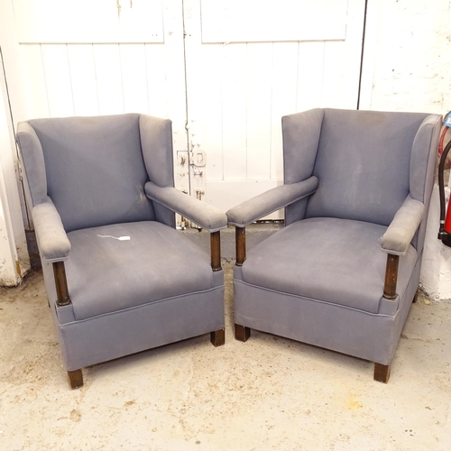 2611 - A pair of early 20th century Heals style wingback open-arm chairs