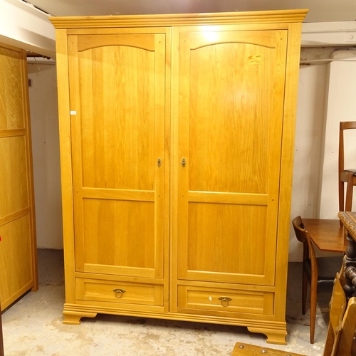 2639 - A modern oak 2-door wardrobe, with 2 drawers under (dismantles for transportation) W158cm, H206cm, D... 