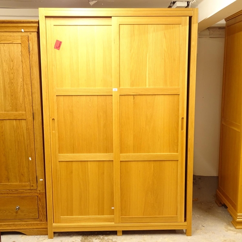 2640 - A modern oak wardrobe, with 2 sliding doors (dismantles for transportation) W130cm, H200cm, D60cm