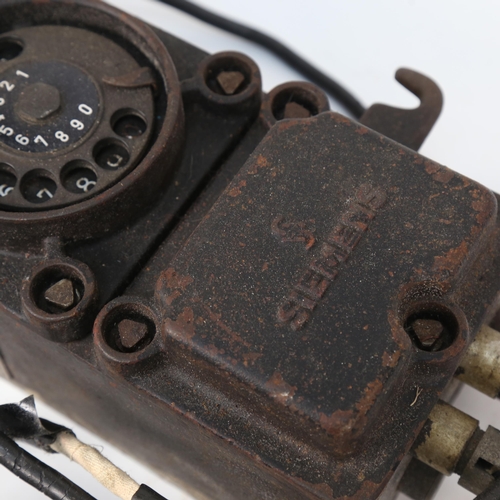 532 - A German Second World War Period Siemens bunker telephone, with original brass plaque, height 49cm