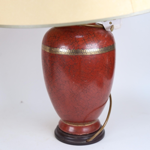 548 - A pair of ceramic table lamps on wooden plinths, with matching shades, height 60cm overall