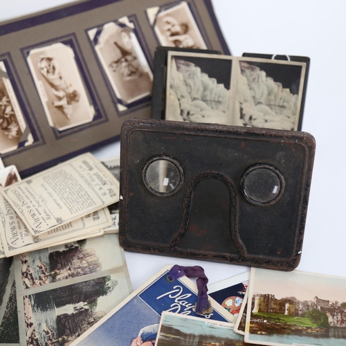 558 - A stereo viewer and various Army Club cigarette card slides, a pair of metal mounts, height 16cm, a ... 