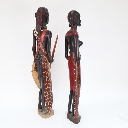 573 - A pair of carved and painted wood Maasai figures, tallest 60cm