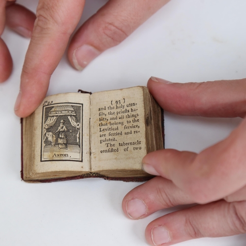 574 - An 18thC miniature Newbery illustrated Bible, dated 1780, height 4cm