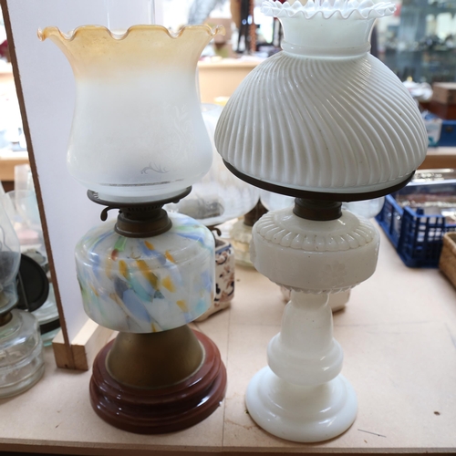 586 - A group of oil lamps, including a pair of Masons Ironstone, a Victorian milk glass oil lamp with sha... 