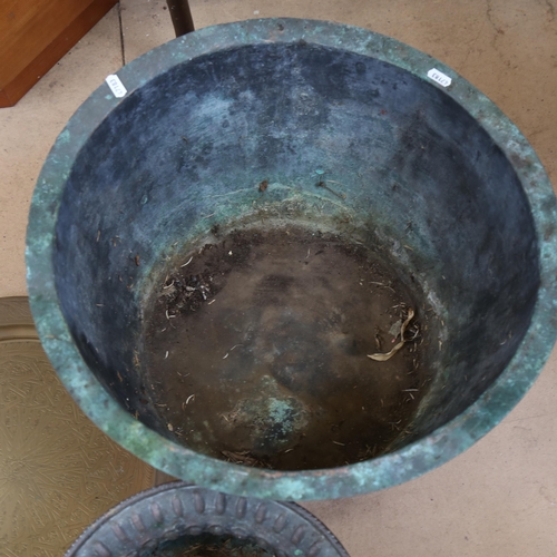 629 - A copper copper, height 34cm, 2 Eastern brass trays, and a lobed copper pot