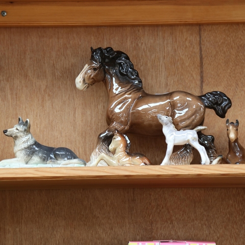 661 - A group of animals, including German fawns, Beswick horses, Branksome Alsatian etc, some A/F