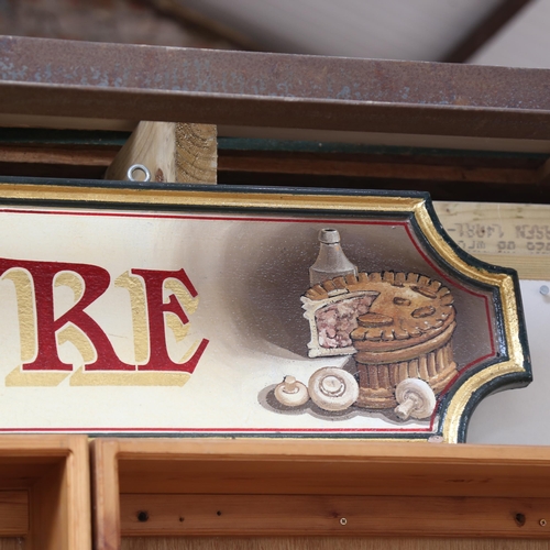 673 - A painted and gilded sign 