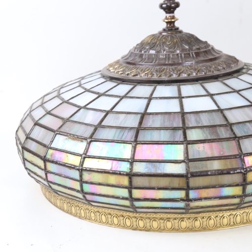 692 - A pair of ornate leaded glass lampshades, with embossed metal mounts, 45cm diameter