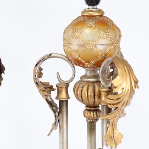 699 - A pair of silvered and gold painted Renaissance style table lamps, height excluding fitting 60cm