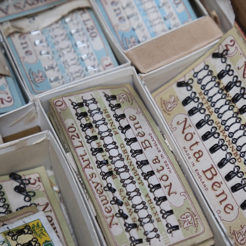 705 - A collection of Vintage hooks and eyes, mounted on cards