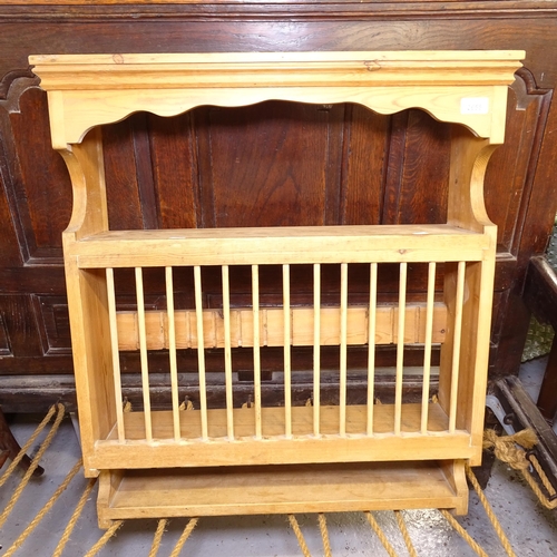 2655 - A pine hanging plate rack, W68cm