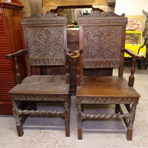 2674 - A pair of 18th century joined oak Wainscot chairs, with relief carved panelled backs, turned legs an... 