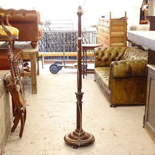 2687 - An Edwardian mahogany turned standard lamp