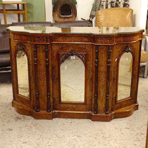 2697 - A Victorian walnut serpentine-front chiffonier base, with a shaped glass top, 3 mirrored cupboard do... 