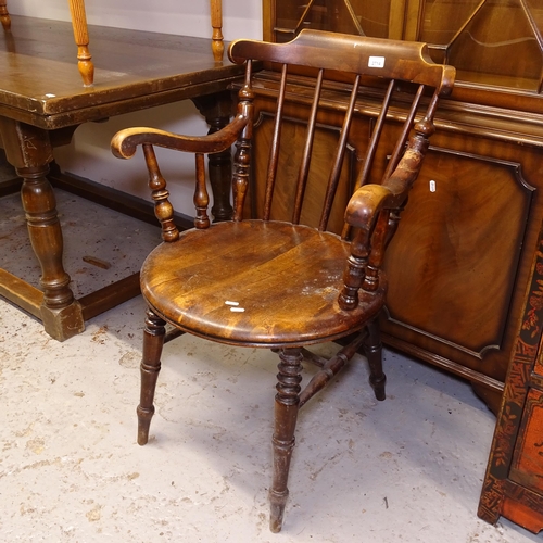 2714 - A Victorian stick-back elm-seated kitchen elbow chair