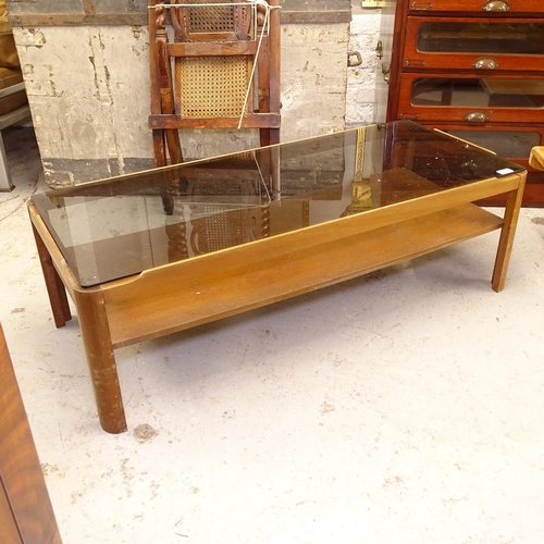 2722 - A mid-century rectangular coffee table, with smoked glass top, and shelf below, L112cm, H35cm, D48cm