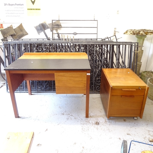 2726 - A Heals mid-century teak writing desk, and matching filing cabinet, desk width 102cm