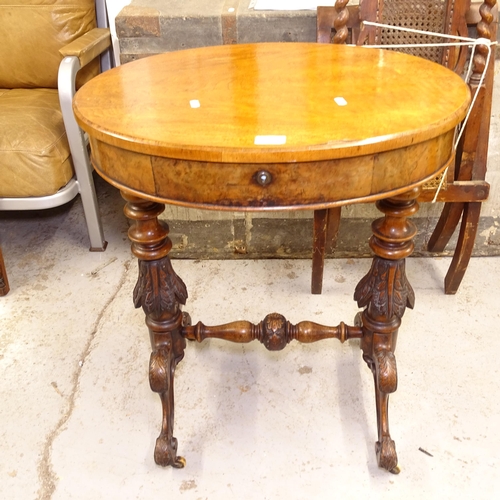 2730 - A Victorian oval walnut sewing table, raised on carved turned legs (missing basket), W60cm, H73cm