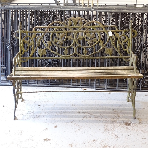 2739 - A small scrolled cast-iron garden bench, L120cm