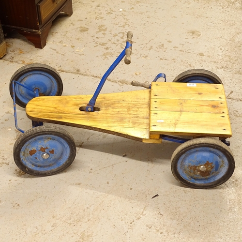 2747 - A child's pine-seated 4-wheet go kart