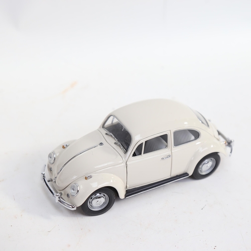 284 - A Franklin Mint 1967 Volkswagen Beetle, boxed and VW Beetle Owner's manual.