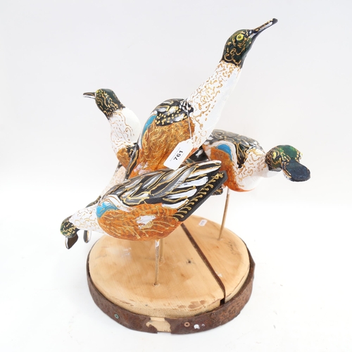 761 - Clive Fredriksson, carved and painted sculpture of a group of ducks, on plinth, height 46cm