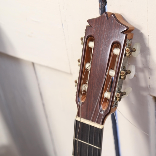 769 - A 6-string acoustic guitar, with fitted case