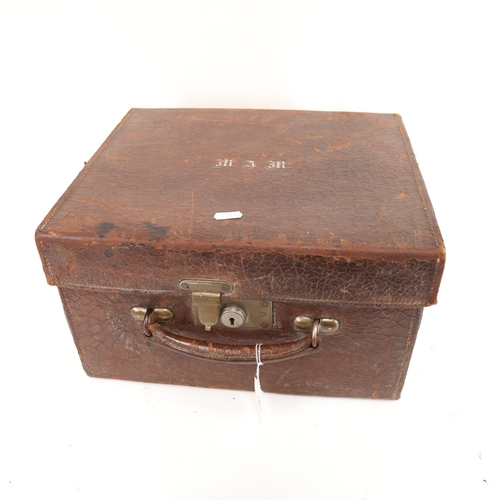 797 - An Antique leather gent's travel case, with some original fittings, including manicure items and mir... 