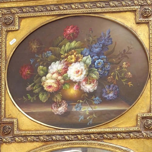 1566 - A large gilt-framed bevel-edge mirror, with inset oil on board still life study of flowers, overall ... 