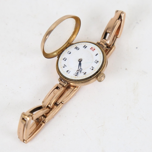 1010 - An early 20th century lady's 9ct gold mechanical wristwatch, on 9ct expanding strap, working order, ... 