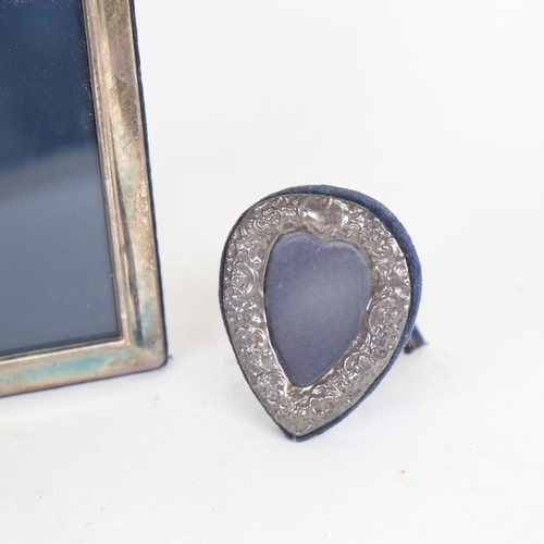 1028 - An Elizabeth II silver-fronted photo frame, overall height 15cm, and a small heart-shaped silver-fro... 