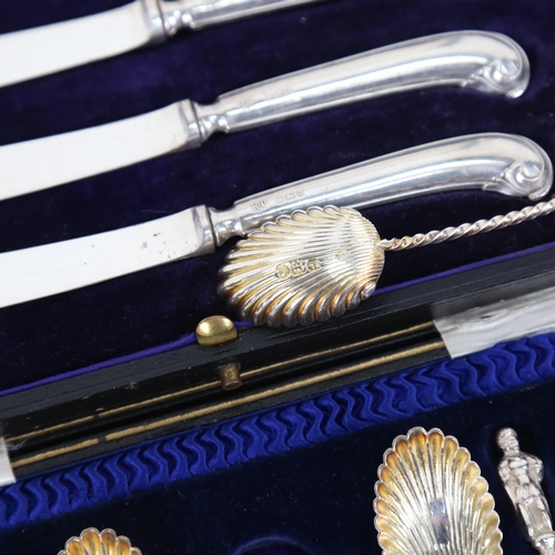 882 - A cased set of Victorian silver teaspoons, and a cased set of 6 silver pistol-handled butter knives ... 