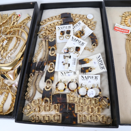 902 - 4 trays of modern gold coloured costume jewellery, including pieces by Napier