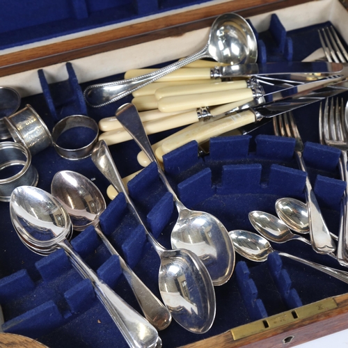 908 - A part canteen of silver plated cutlery, 3 silver napkin rings, a carving set etc