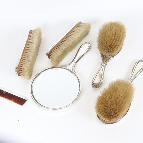 911 - A Victorian tortoiseshell and silver-mounted 6-piece dressing table brush and mirror set