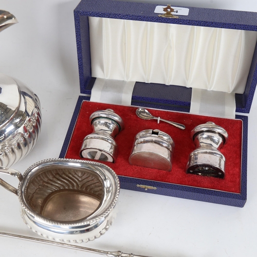 914 - A silver plated coffee pot and cream jug, a cruet set, and a candle snuffer