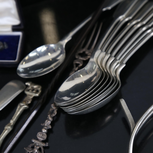 917 - A box with silver teaspoons, a Continental silver pickle fork, plated spoons, stone set brooch, silv... 