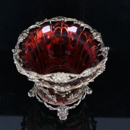 924 - A silver plate on copper leaf design basket, with swing handle and cranberry glass liner