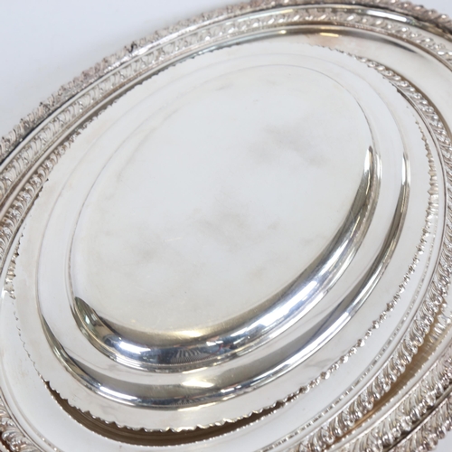 937 - A graduated set of 4 silver plated serving trays, with cast edge