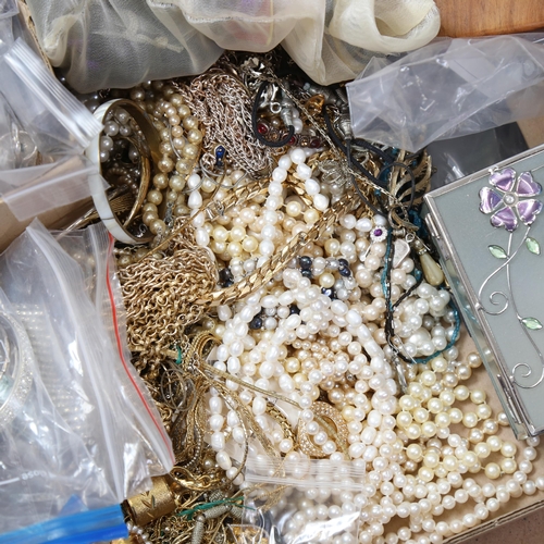 942 - A large tray of pearls, bangles, beads, necklaces etc