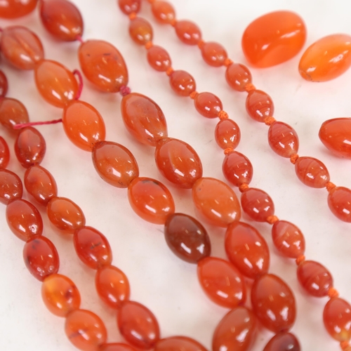 955 - 2 cornelian bead necklaces, and 4 spare unmounted beads