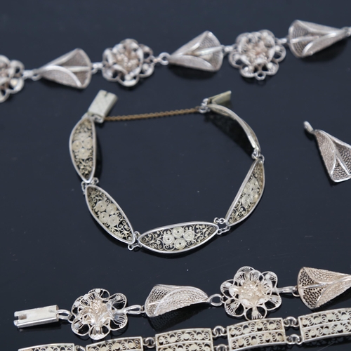 966 - A silver filigree demi-parure set of jewellery, filigree bracelets etc